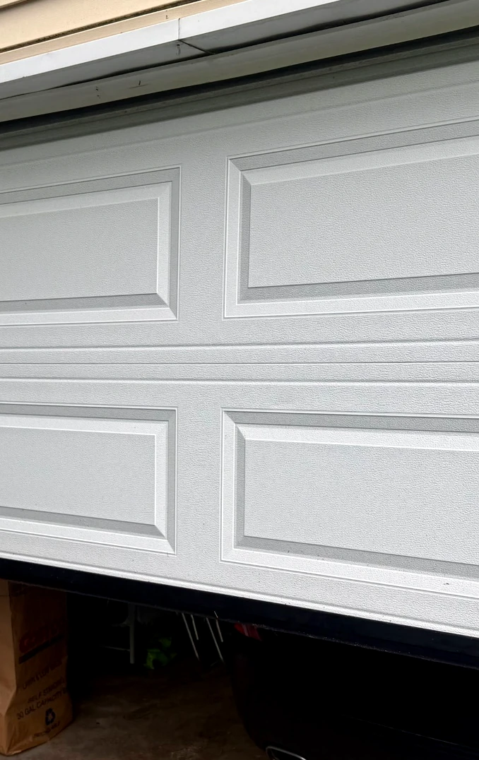 Garage door bottom edge and weather seal detail from a real Swift Garage Doors job