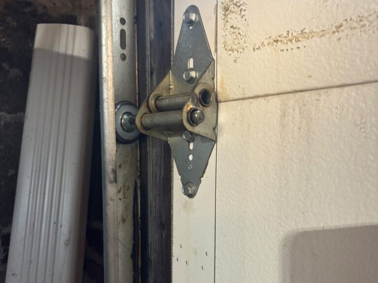 New garage door roller installed in the track of a residential garage door in Niles, IL